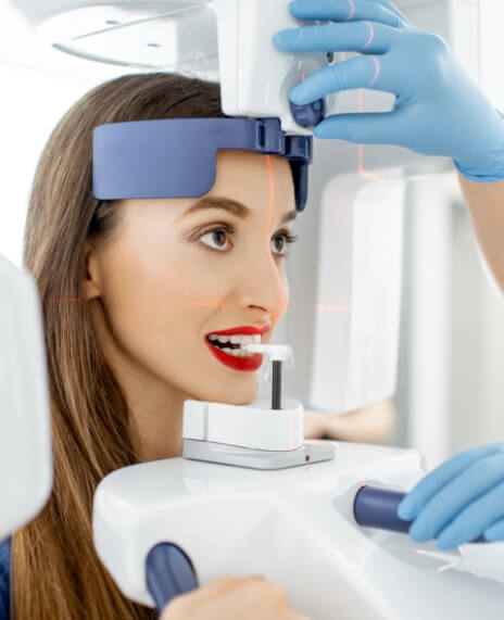 Woman receiving 3 D C T cone beam digital x-ray scans