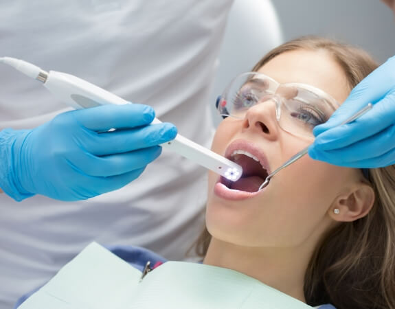 Dental patient receiving fluoride treatment