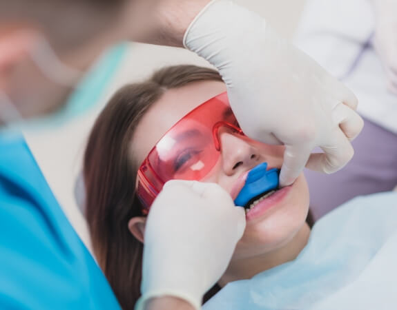 Child receiving fluoride treatment