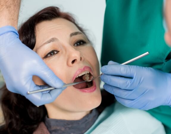 Dental patient receiving emergency dentistry treatment