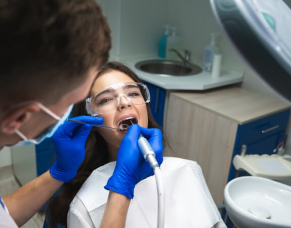 Dentist providing root canal therapy