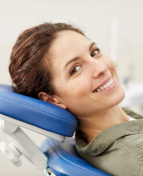 Woman smiling during dental appointment