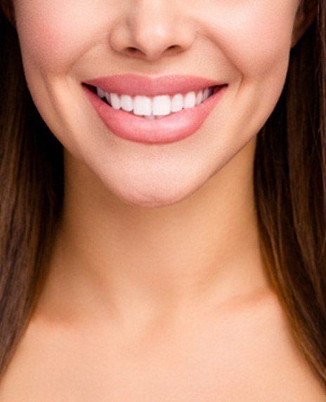 A smiling woman showing off her dental veneers in Morganville