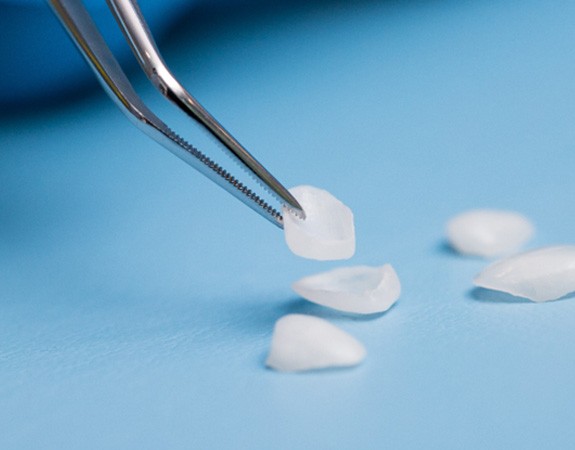 A close up of several dental veneers in Marlboro