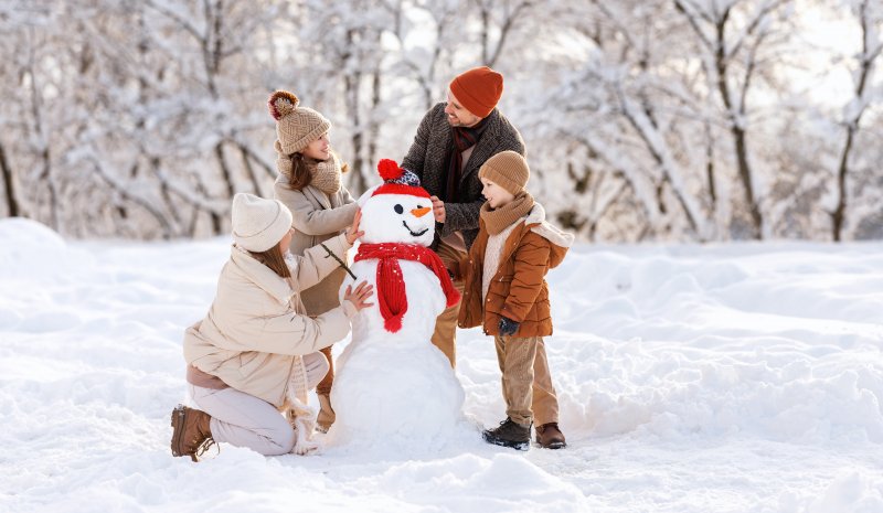 Family playing in the snow