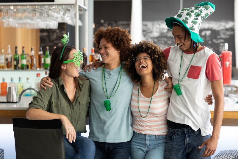 A group of friends celebrating St. Patrick’s Day at a bar