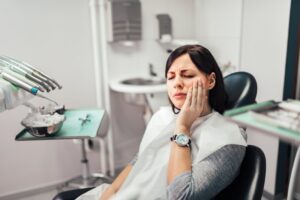 Woman at her dentist with a dental emergency